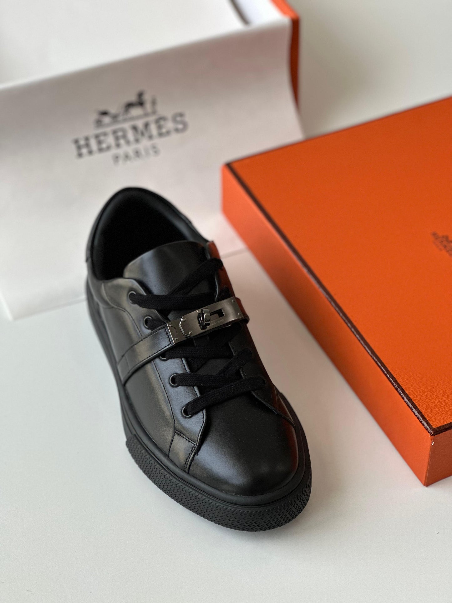 Hermès Day Sneaker in Black Calfskin with Kelly Buckle – Modern Urban Leather Sneaker.