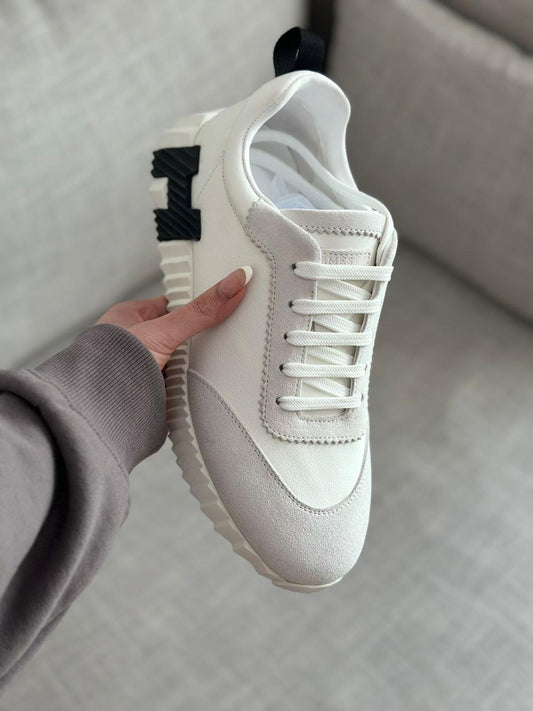 Hermès Bouncing Sneakers in white.