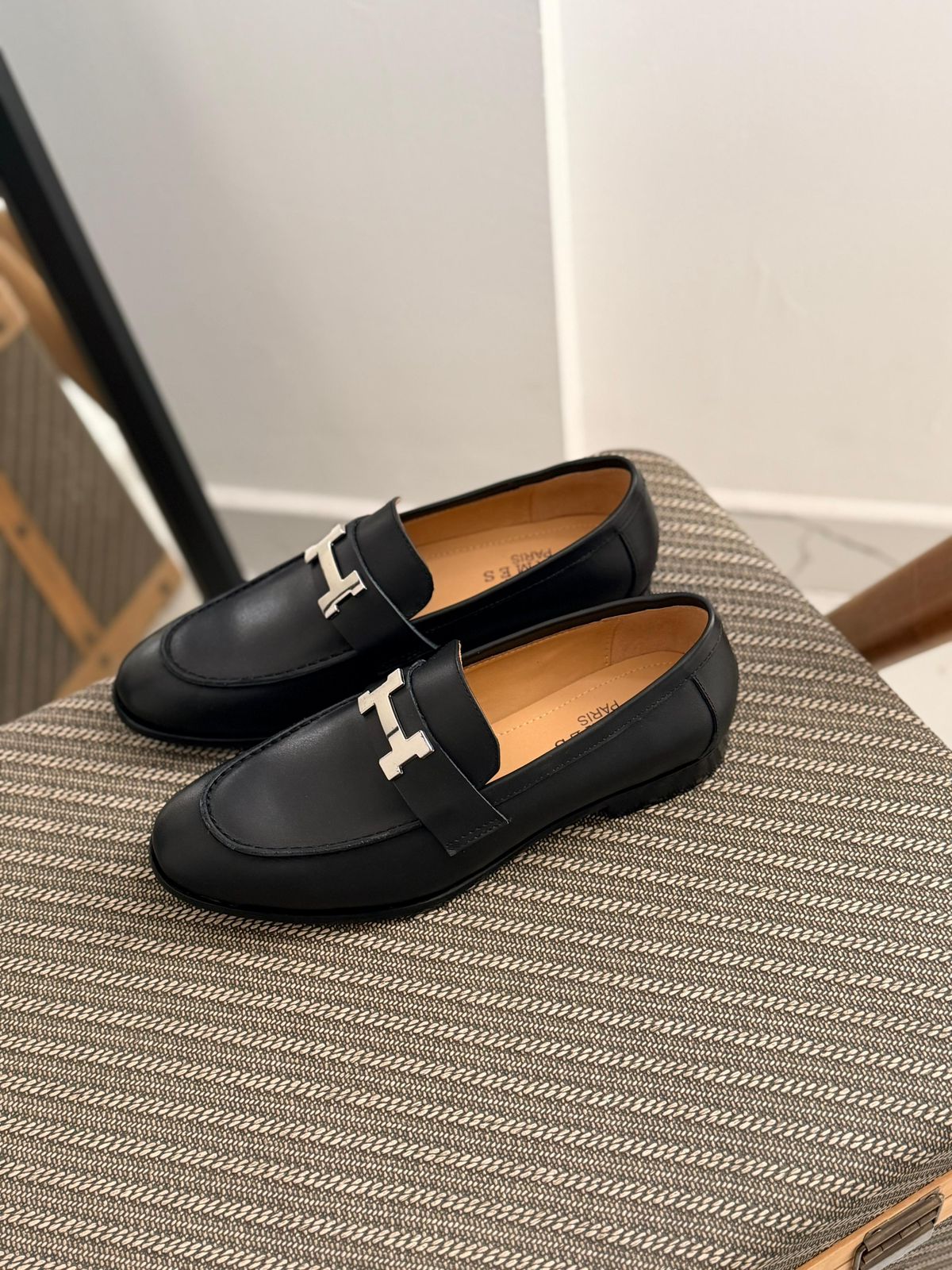 Hermès Paris Loafer, featuring a signature "H" buckle and goatskin leather construction.
