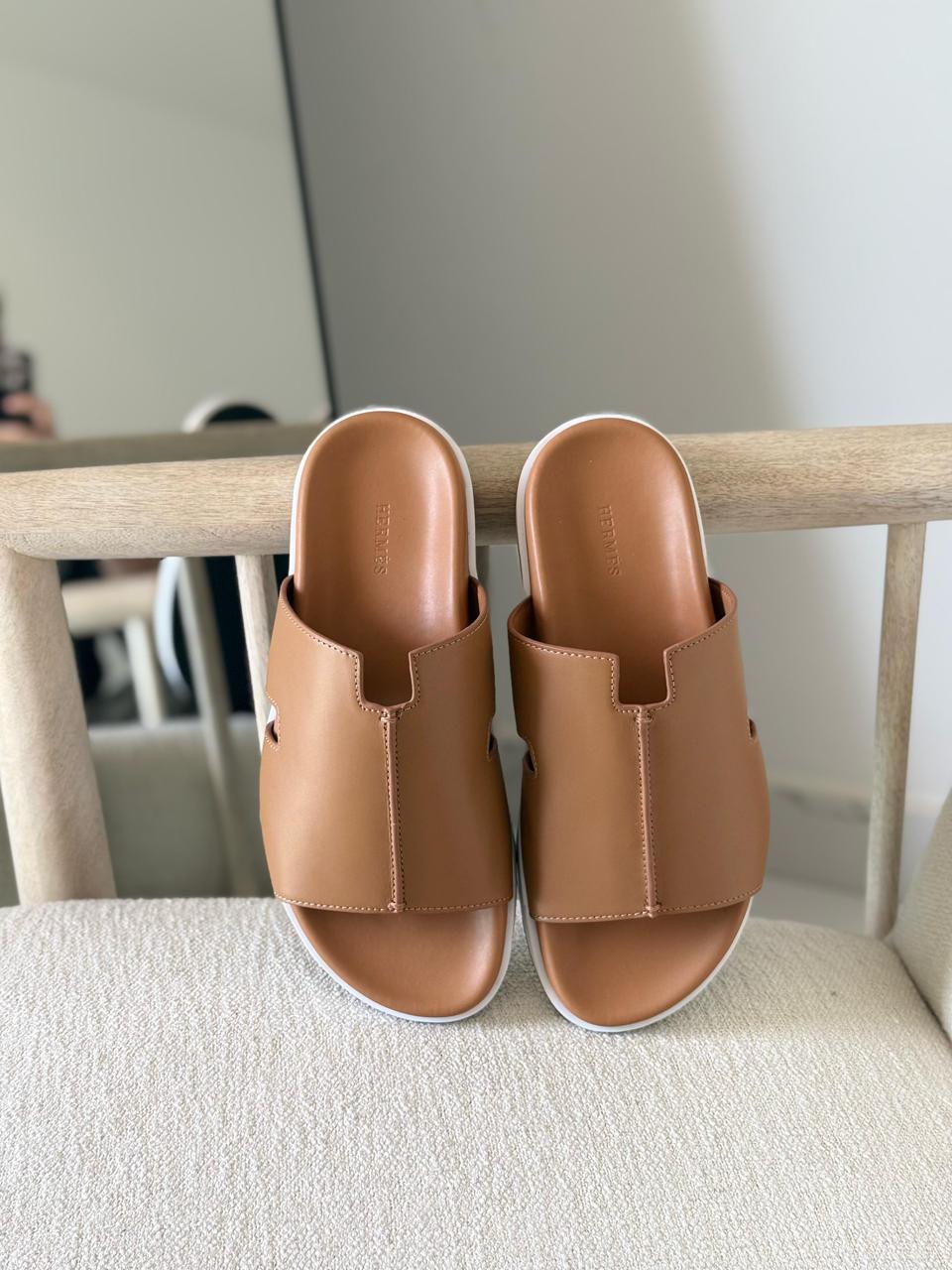 Hermès Brown Leather Pharaon Sandals casual slide style and a thick white sole.
