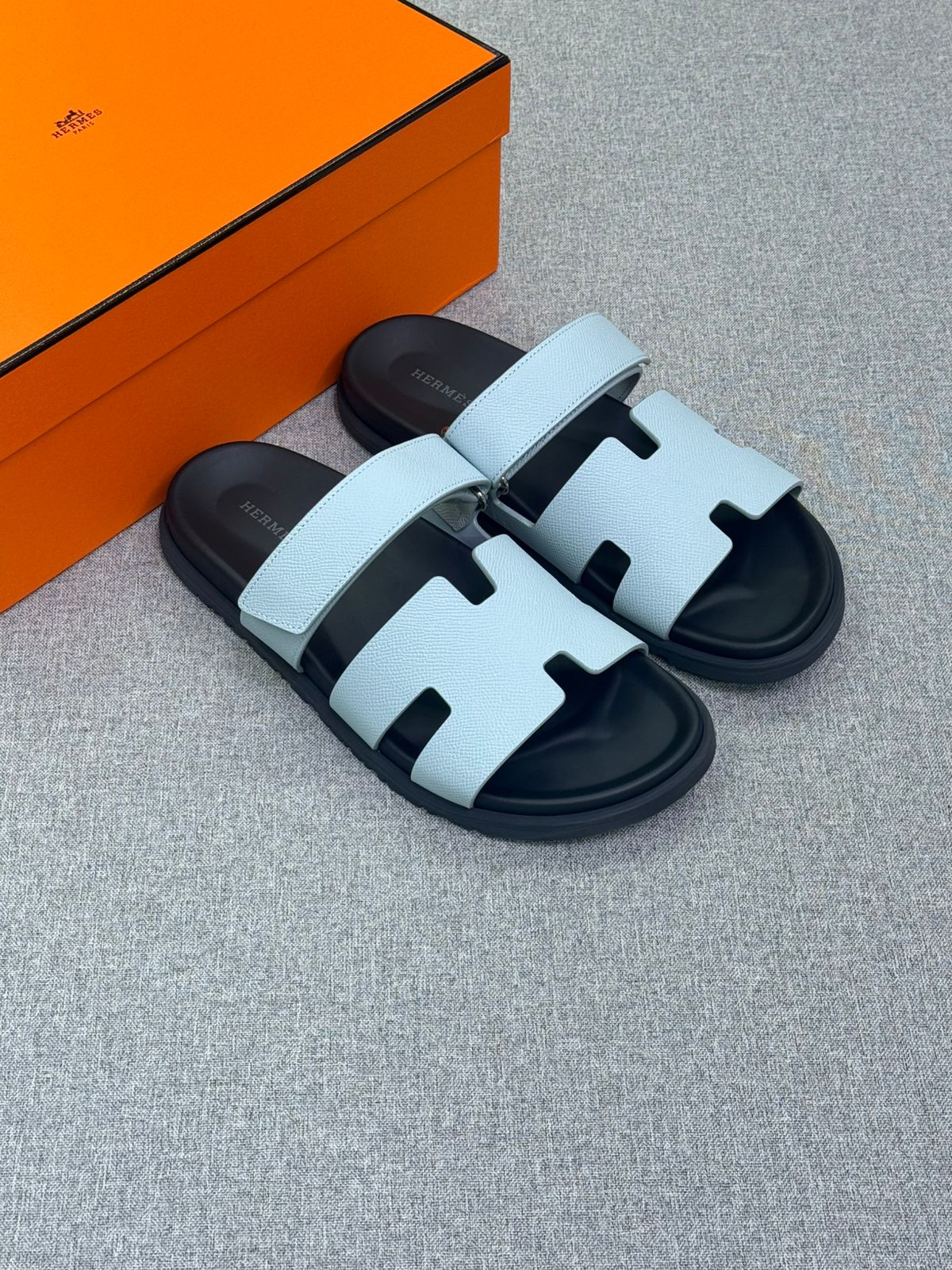 Hermès Chypre sandals with a signature H-cutout strap,