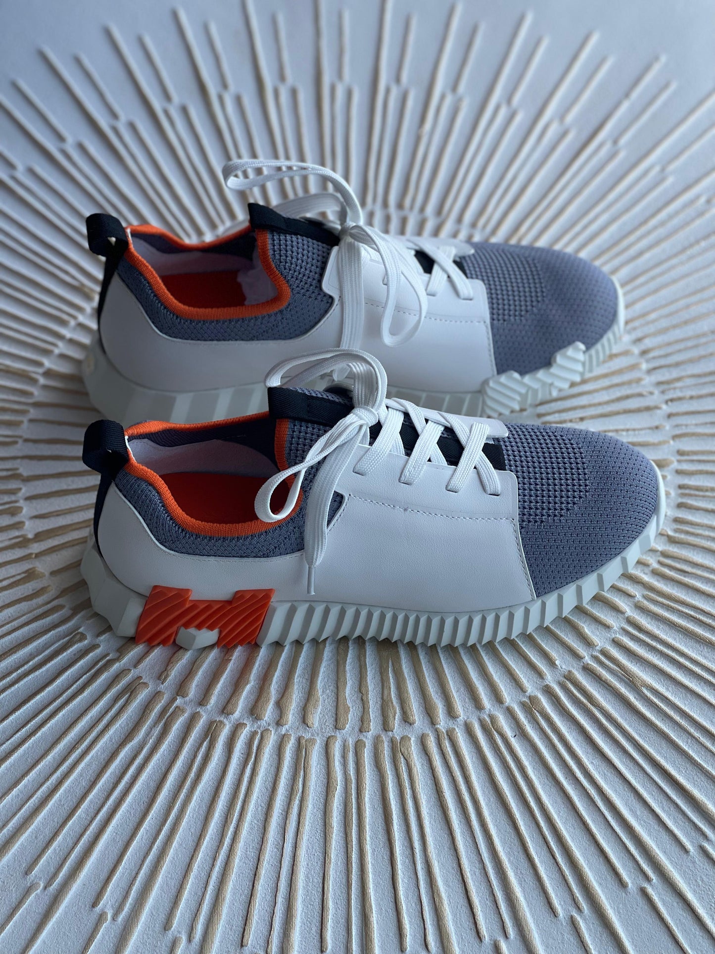 Hermès Depart Slip-On Sneaker – Knit & Calfskin Minimalist Design with Signature Orange Edge