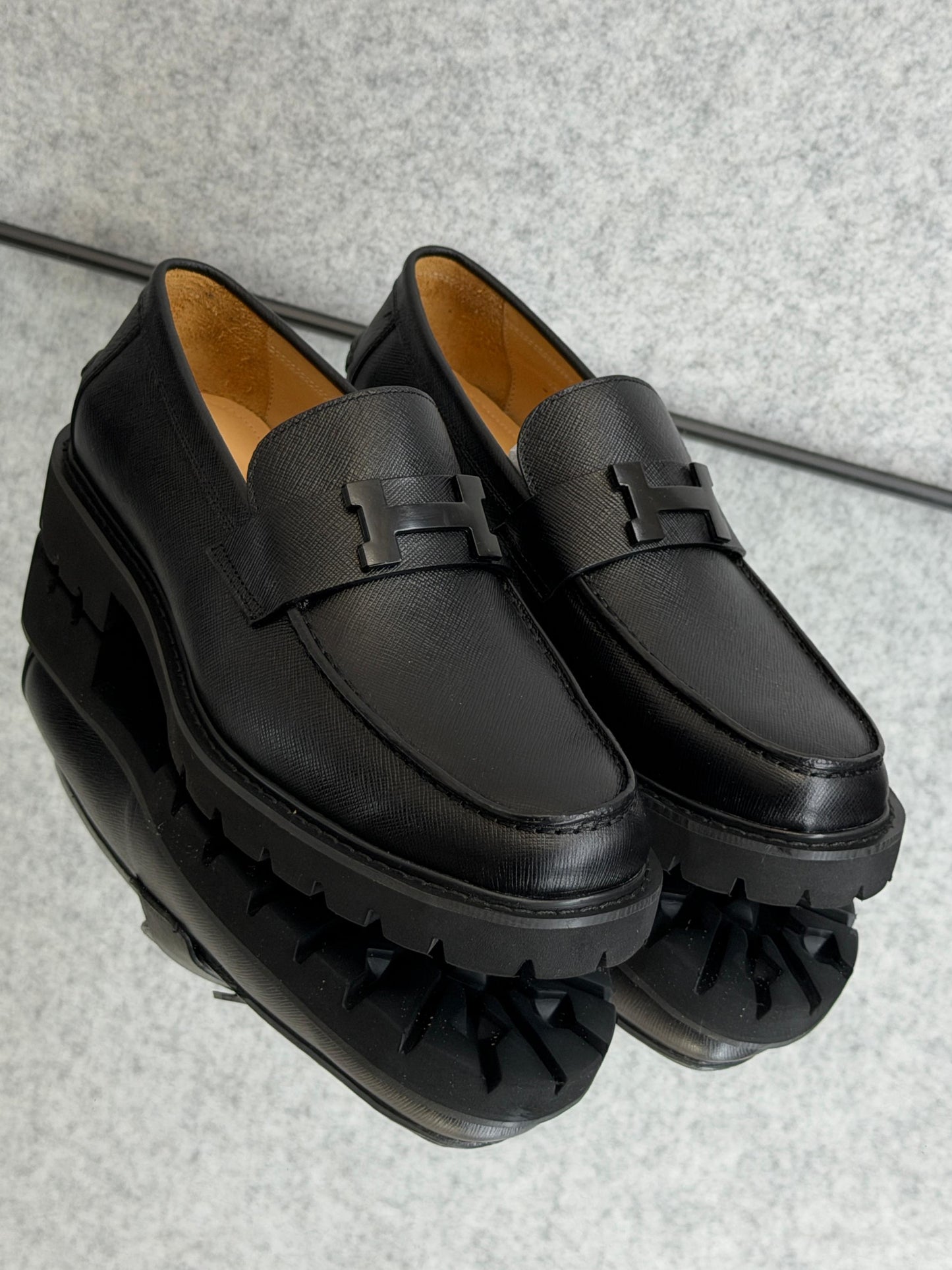 Hermès Grégoire loafer, a classic men's slip-on shoe crafted in Italy from calfskin leather.