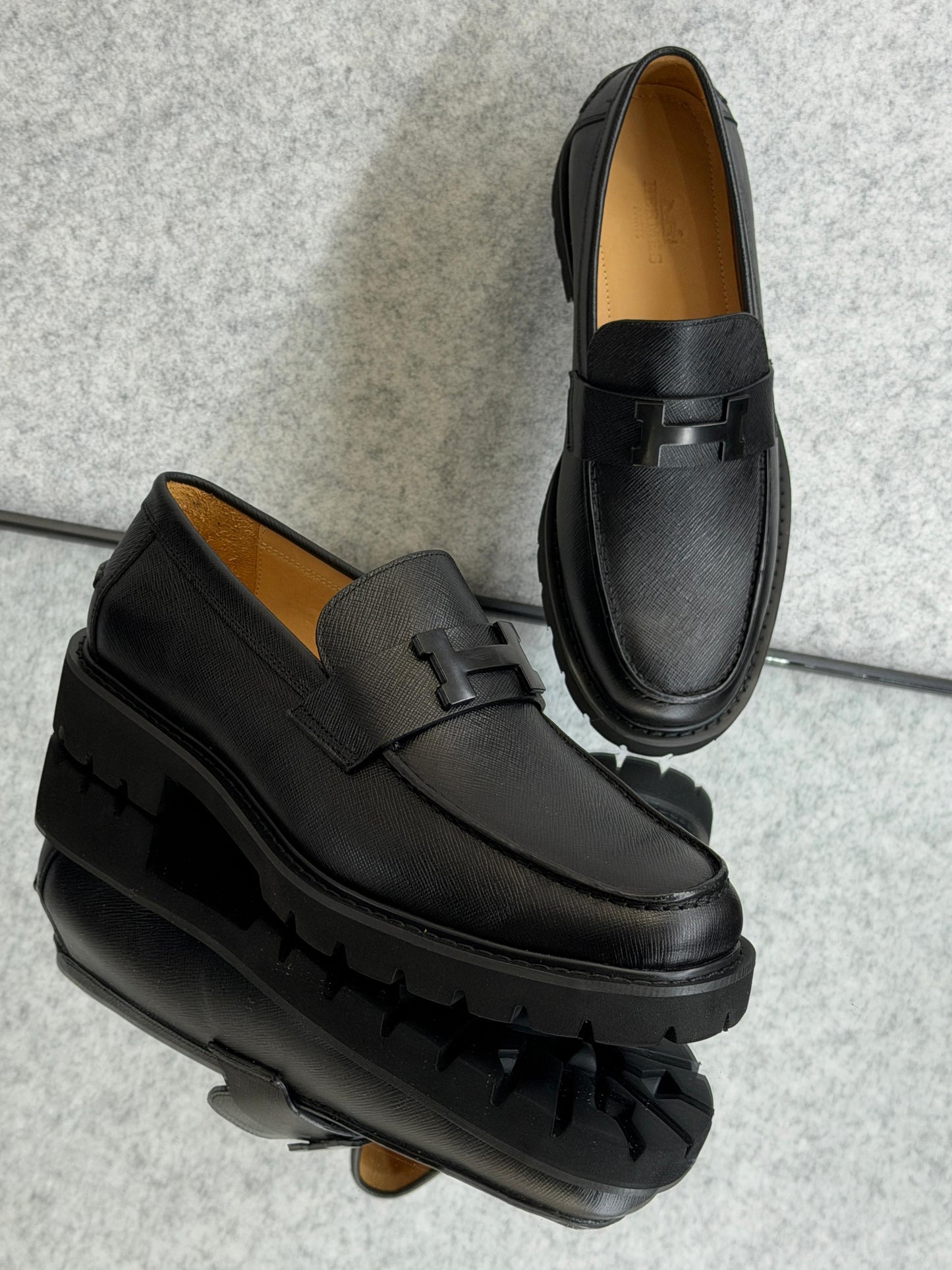 Hermès Grégoire loafer, a classic men's slip-on shoe crafted in Italy from calfskin leather.