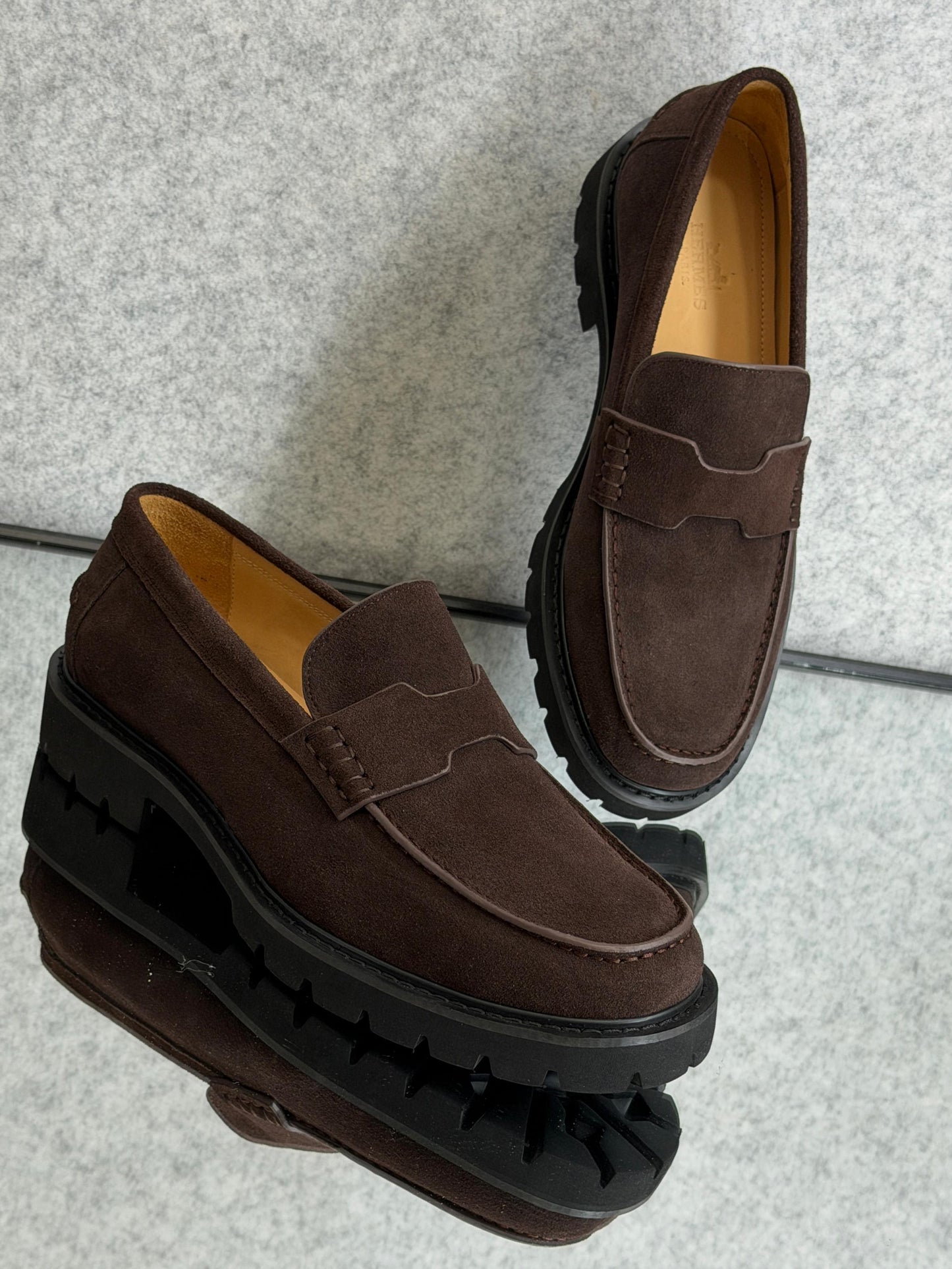 Hermès Klement loafer, crafted from brown suede calfskin with a chunky rubber sole.