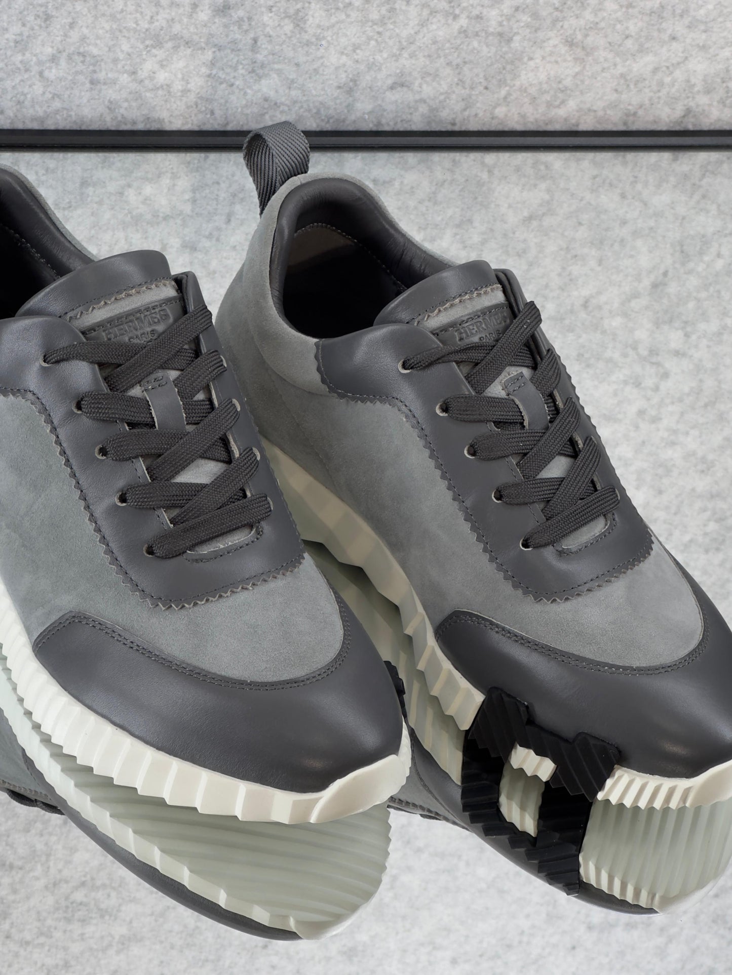 Hermès Bouncing Sneakers in the Gris Orage colorway, crafted from suede goatskin and calfskin.