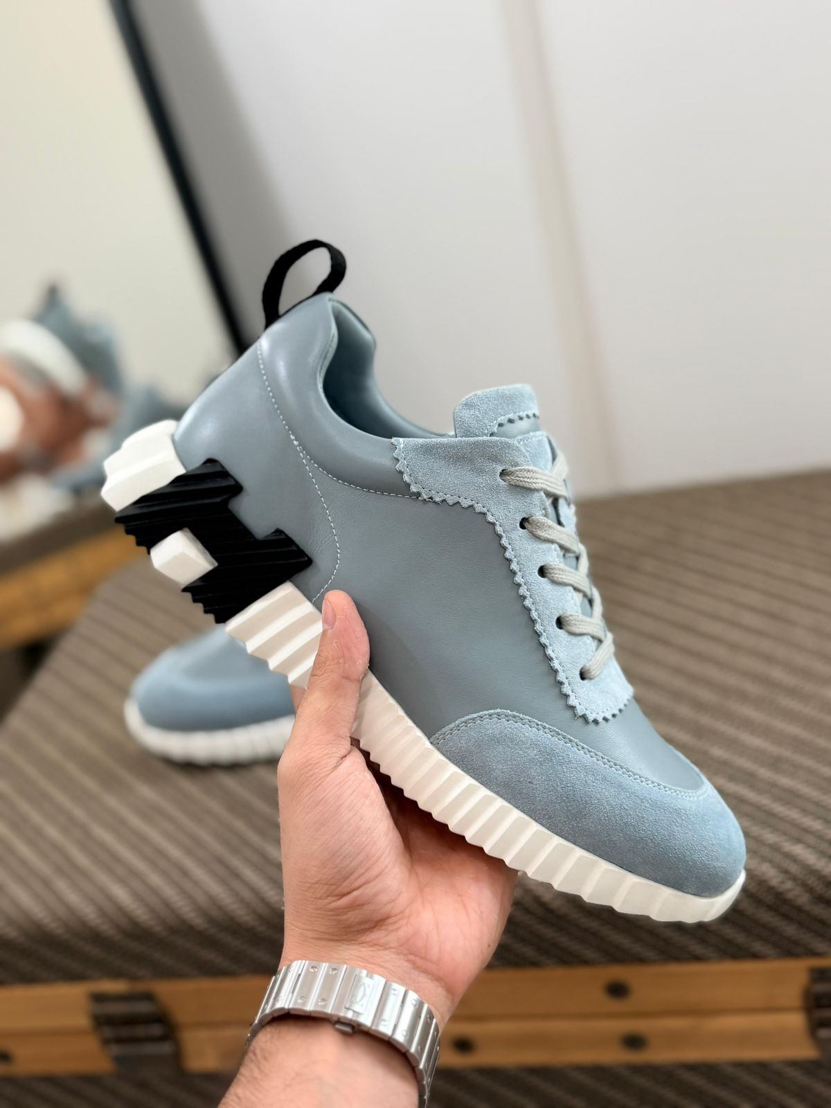 Hermès Bouncing sneaker, crafted in calfskin and suede goatskin with a contrasting rubber sole.
