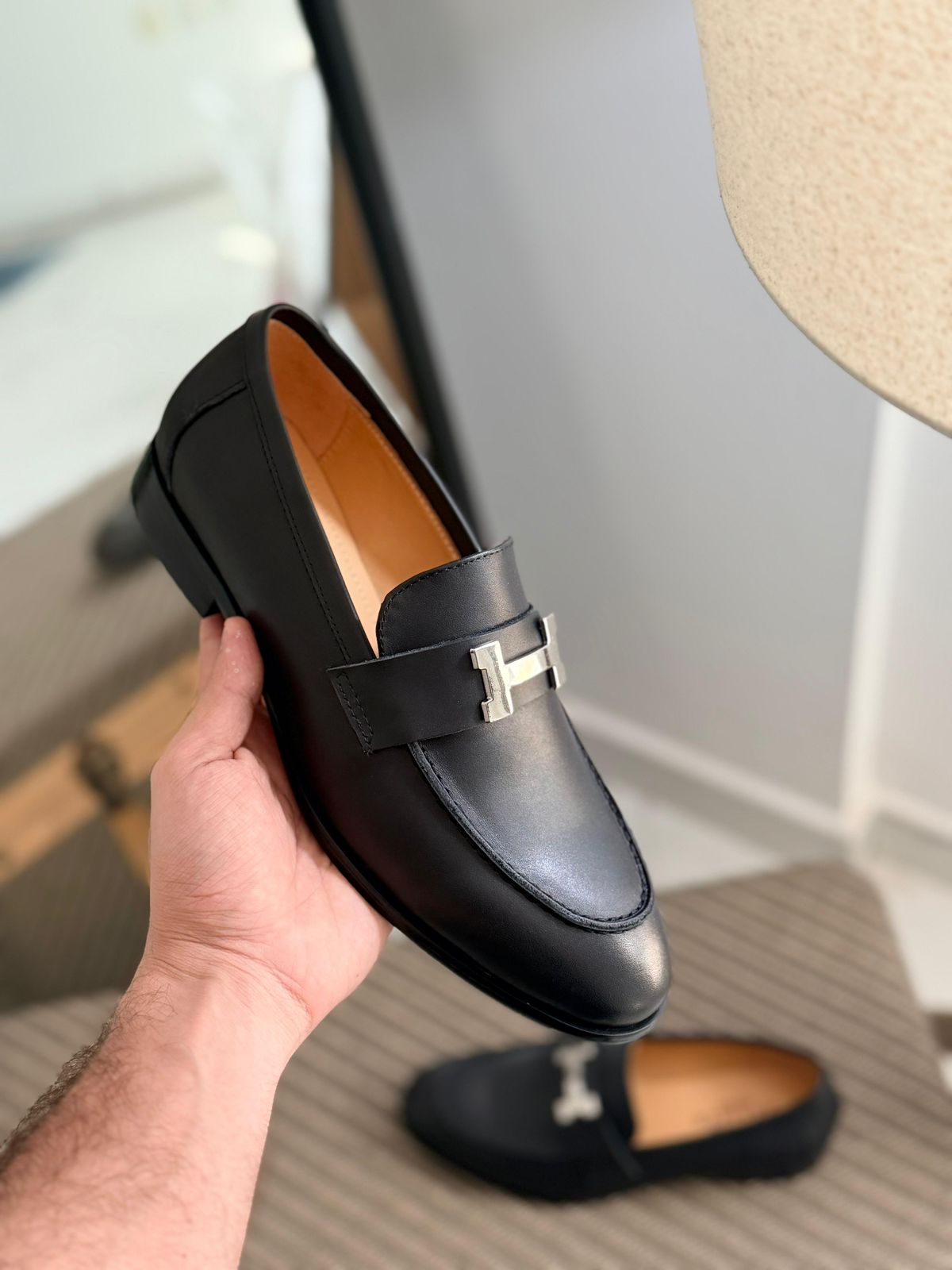 Hermès Paris Loafer, featuring a signature "H" buckle and goatskin leather construction.