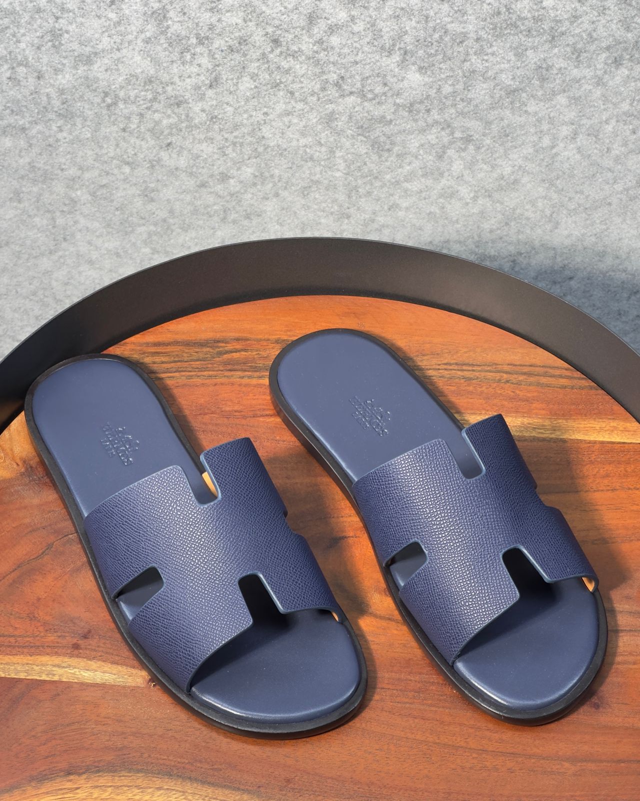 Hermès Izmir sandals in Epsom blue calfskin with the iconic H cut-out.