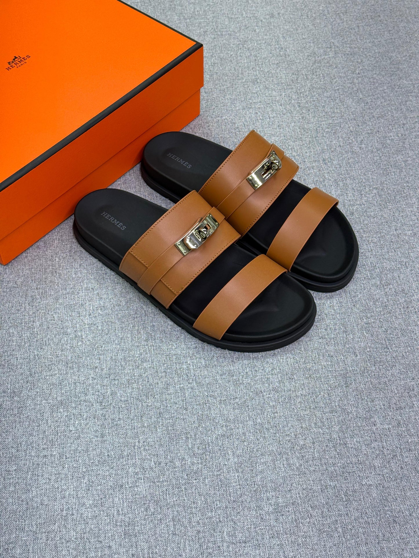 Hermès Jackson Sandal  calfskin leather and an iconic Kelly buckle.