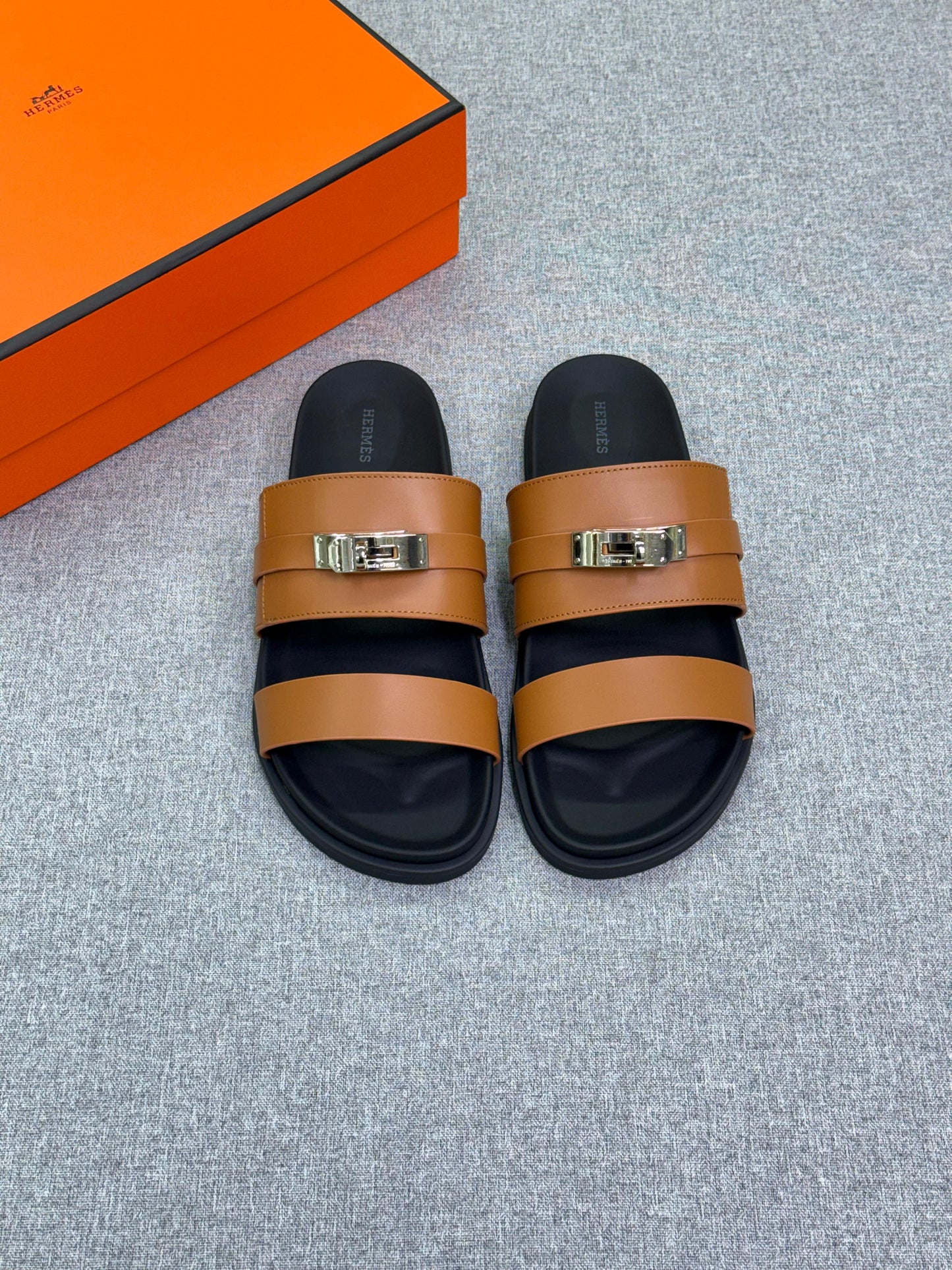 Hermès Jackson Sandal  calfskin leather and an iconic Kelly buckle.