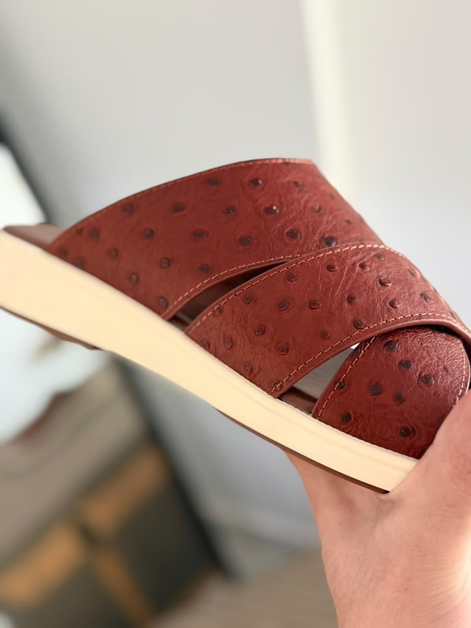 Loro Piana Palm Walk Sandals crafted from  ostrich leather.