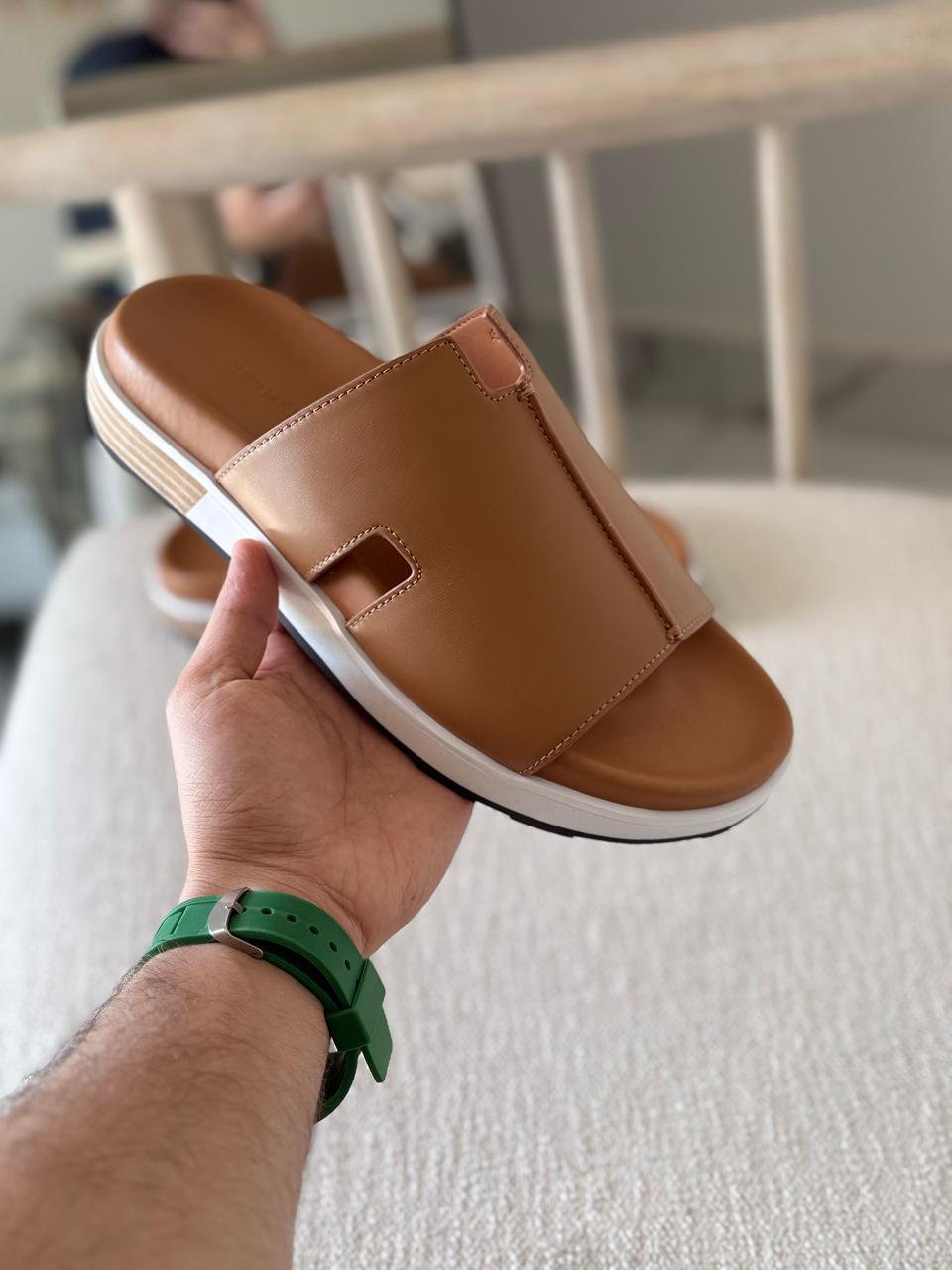 Hermès Brown Leather Pharaon Sandals casual slide style and a thick white sole.