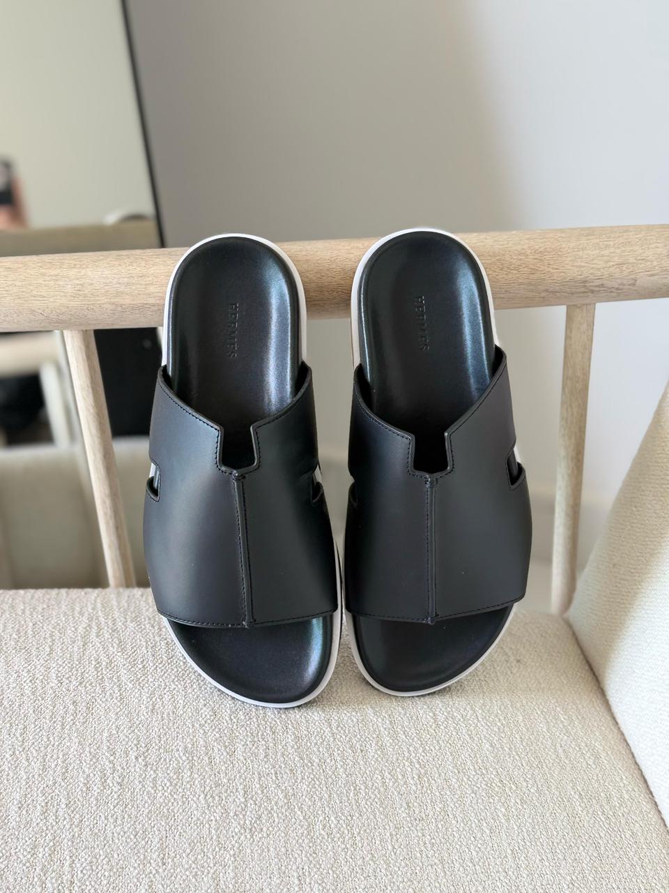 Hermès Pharaon sandals in black.