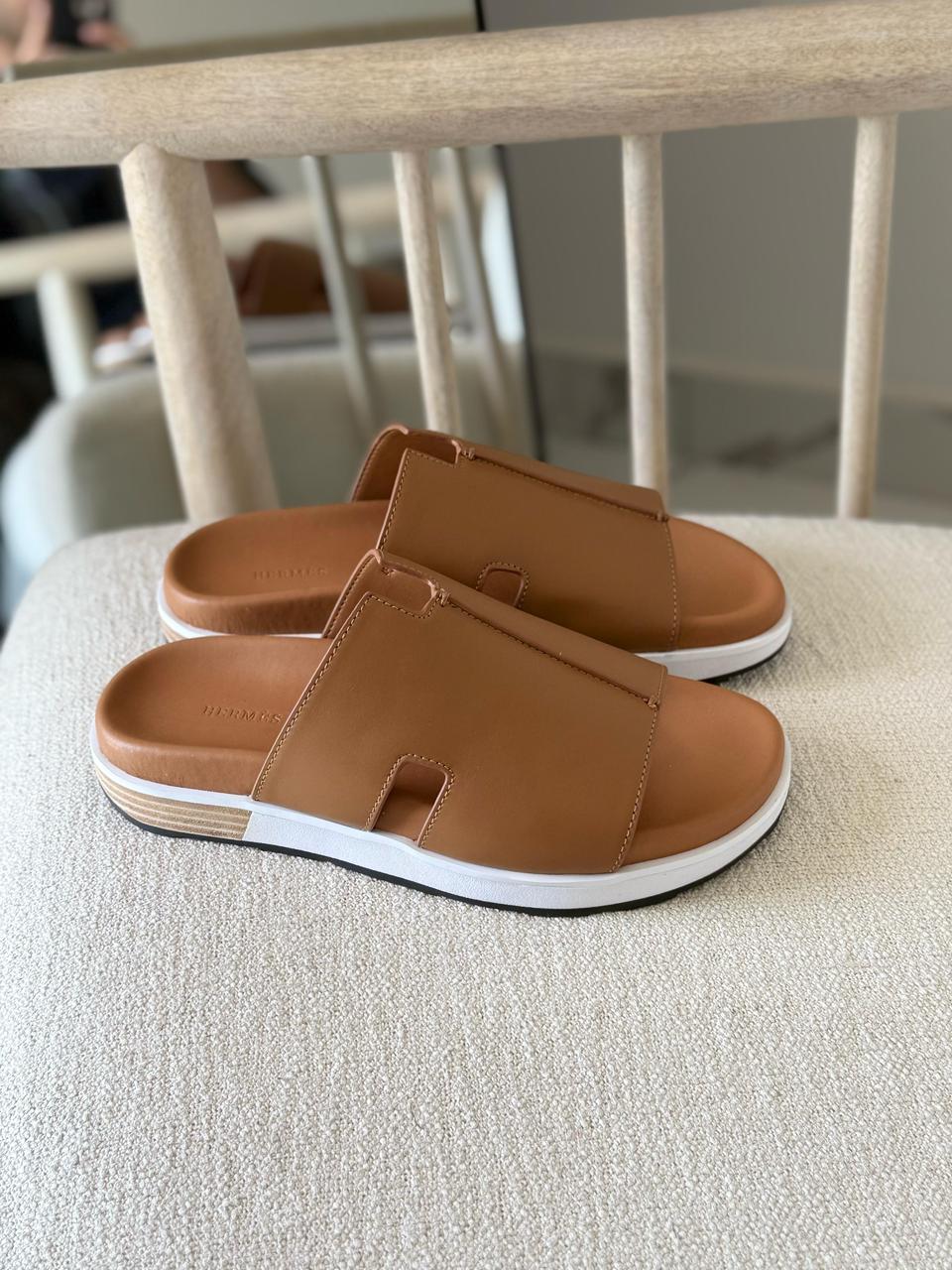 Hermès Brown Leather Pharaon Sandals casual slide style and a thick white sole.