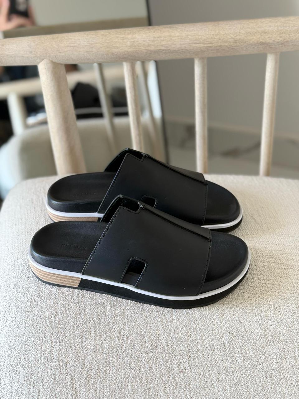 Hermès Pharaon sandals in black.