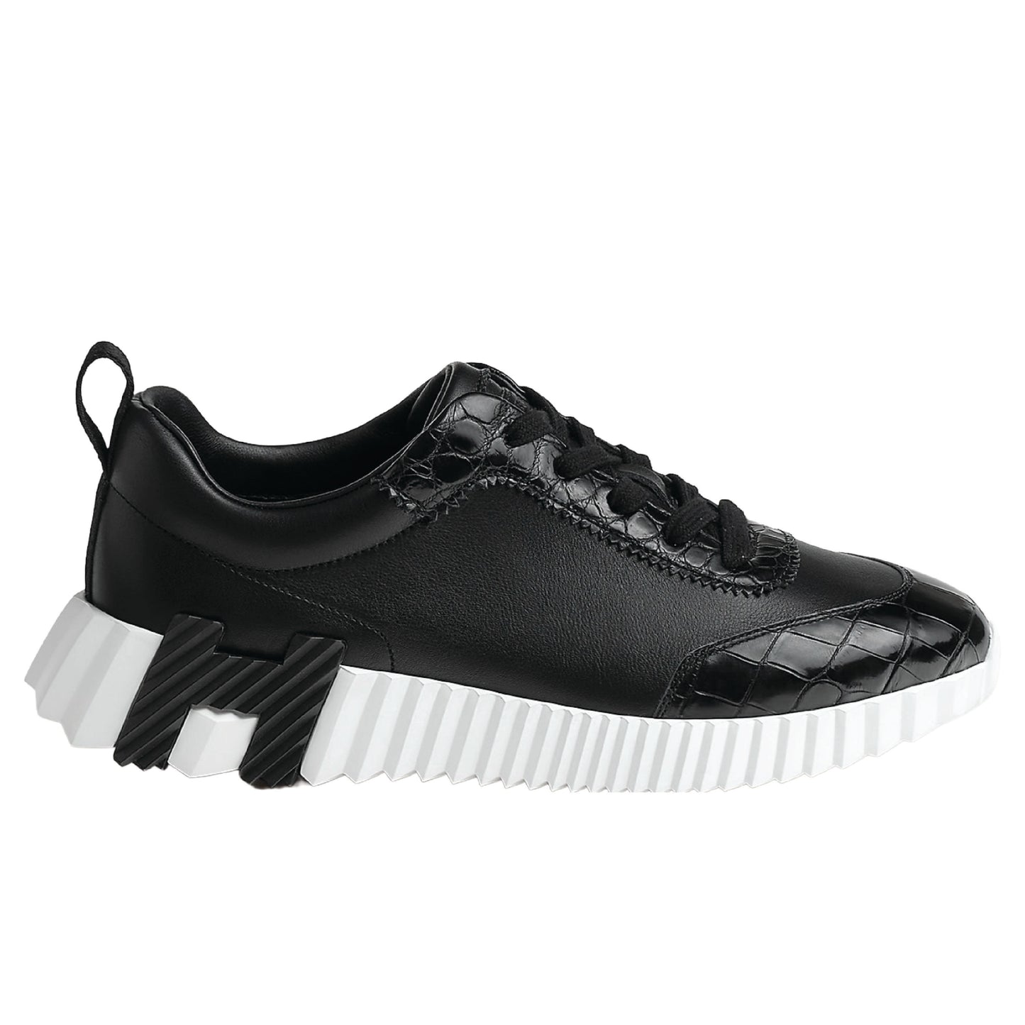 Hermès Bouncing Sneaker, crafted with a combination of materials and featuring a bold, contrasting rubber sole.