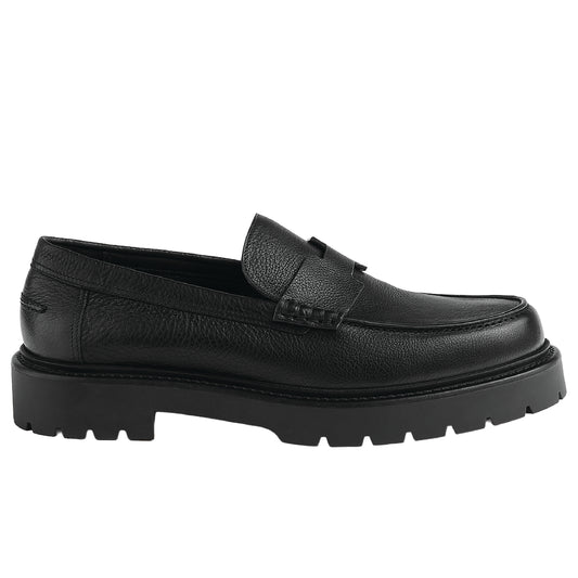 Hermès Klement Loafer in black buffalo leather with a chunky rubber sole.