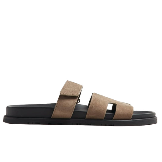 Hermès Chypre sandals brown suede upper with a black rubber sole.