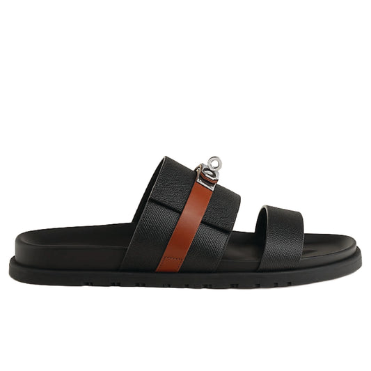 Hermès Jackson Sandals in black leather with a palladium-plated Kelly buckle.