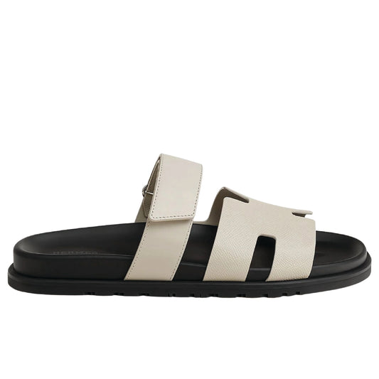 Hermès Chypre sandal in Beige Argile calfskin leather with a black anatomic rubber sole.